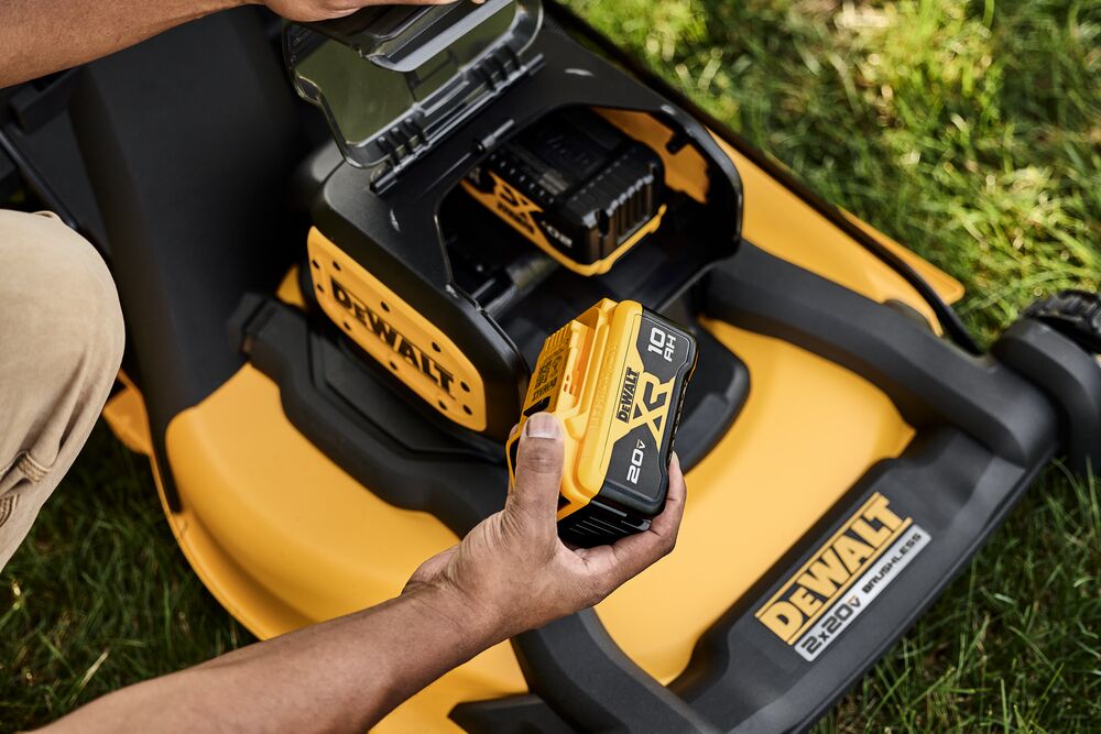 Landscaper swapping out 60V batteries for mower